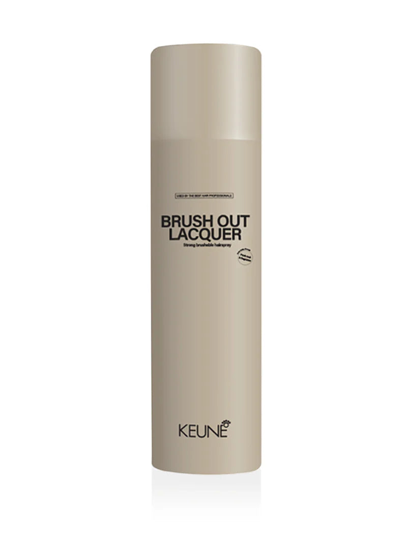 Beige bottle of Keune Brush Out Lacquer on a white background