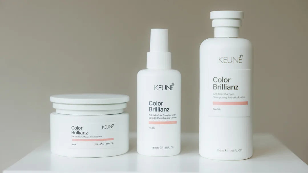 keune color brillianz products in white bottles on white table