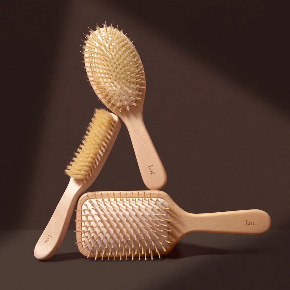 Loc styling brushes on brown background