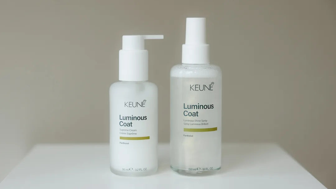 Keune luminous coat hair product bottles on white table
