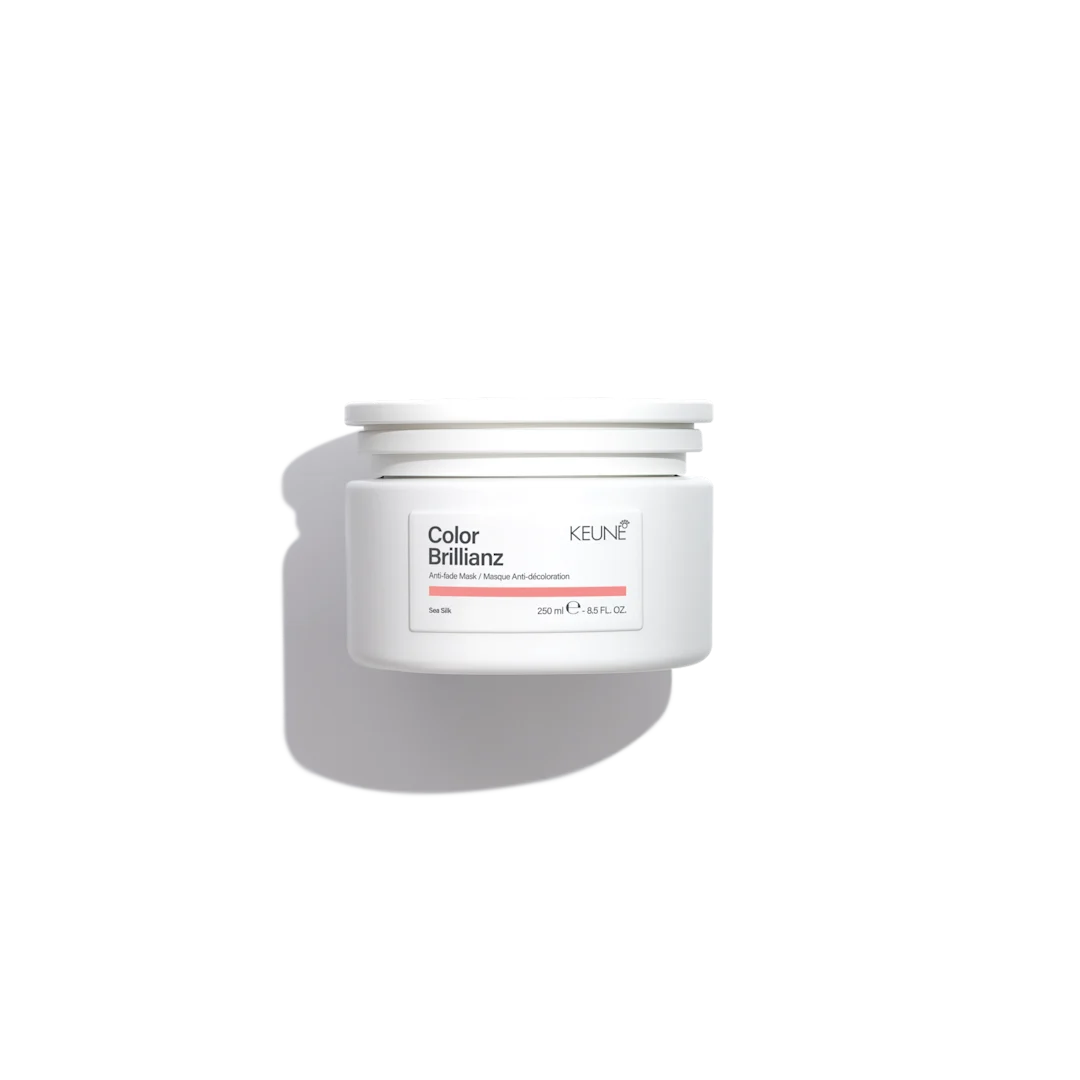 White hair care product container with 'Color Brillianz' and 'Keune' branding on a white background