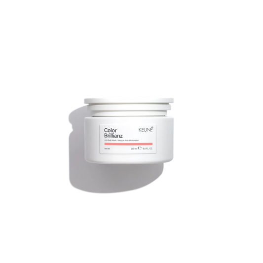 White hair care product container with 'Color Brillianz' and 'Keune' branding on a white background