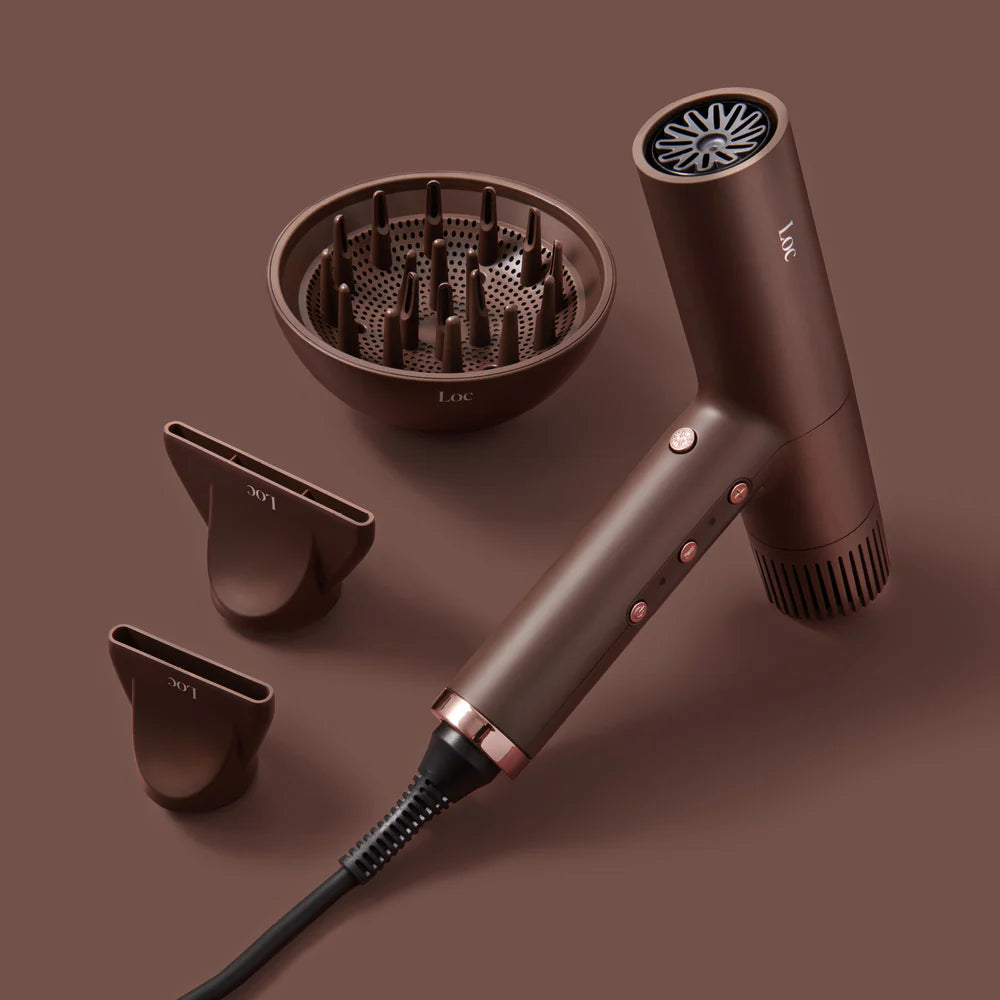 Brown hair dryer set with attachments on a brown background