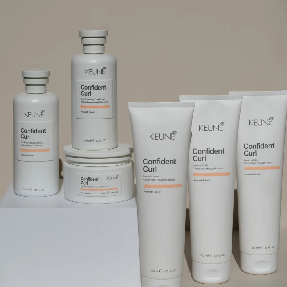 Keune Confident Curl hair care products on a neutral background