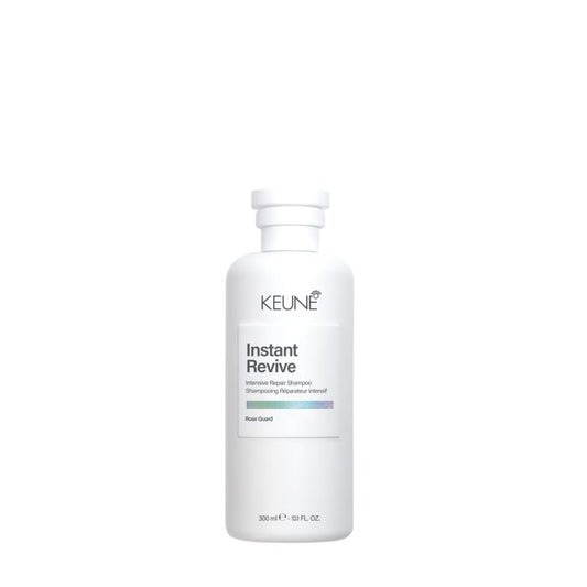 A white bottle of KEUNE Instant Revive Rapid Recovery Hair Shampoo on a solid white background.
