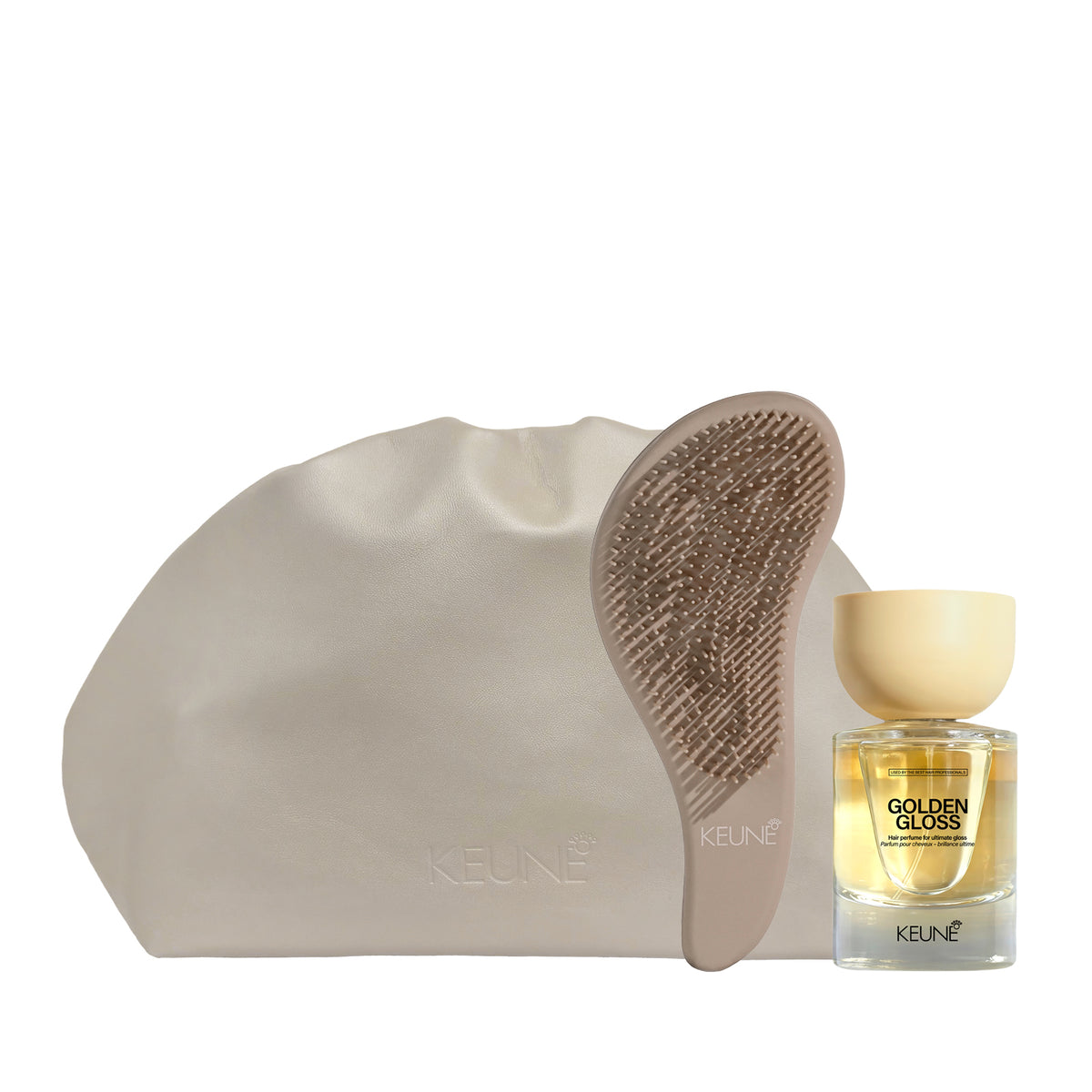Keune golden gloss and hair brush with bag on white backgroung