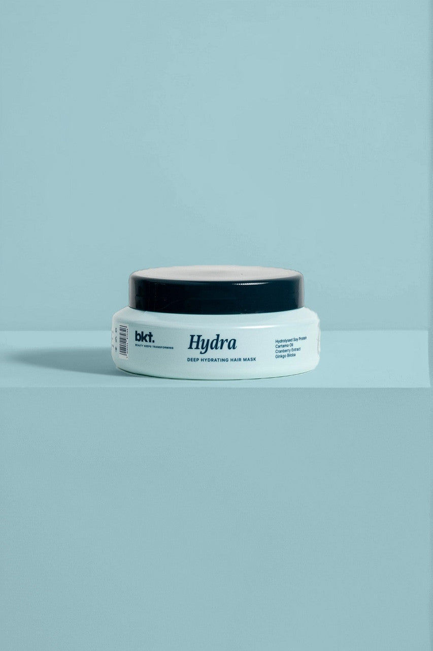 Jar of 'Hydra' hair mask on a light blue background