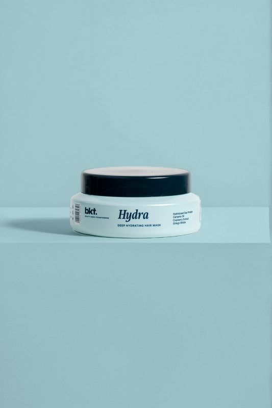 Jar of 'Hydra' hair mask on a light blue background