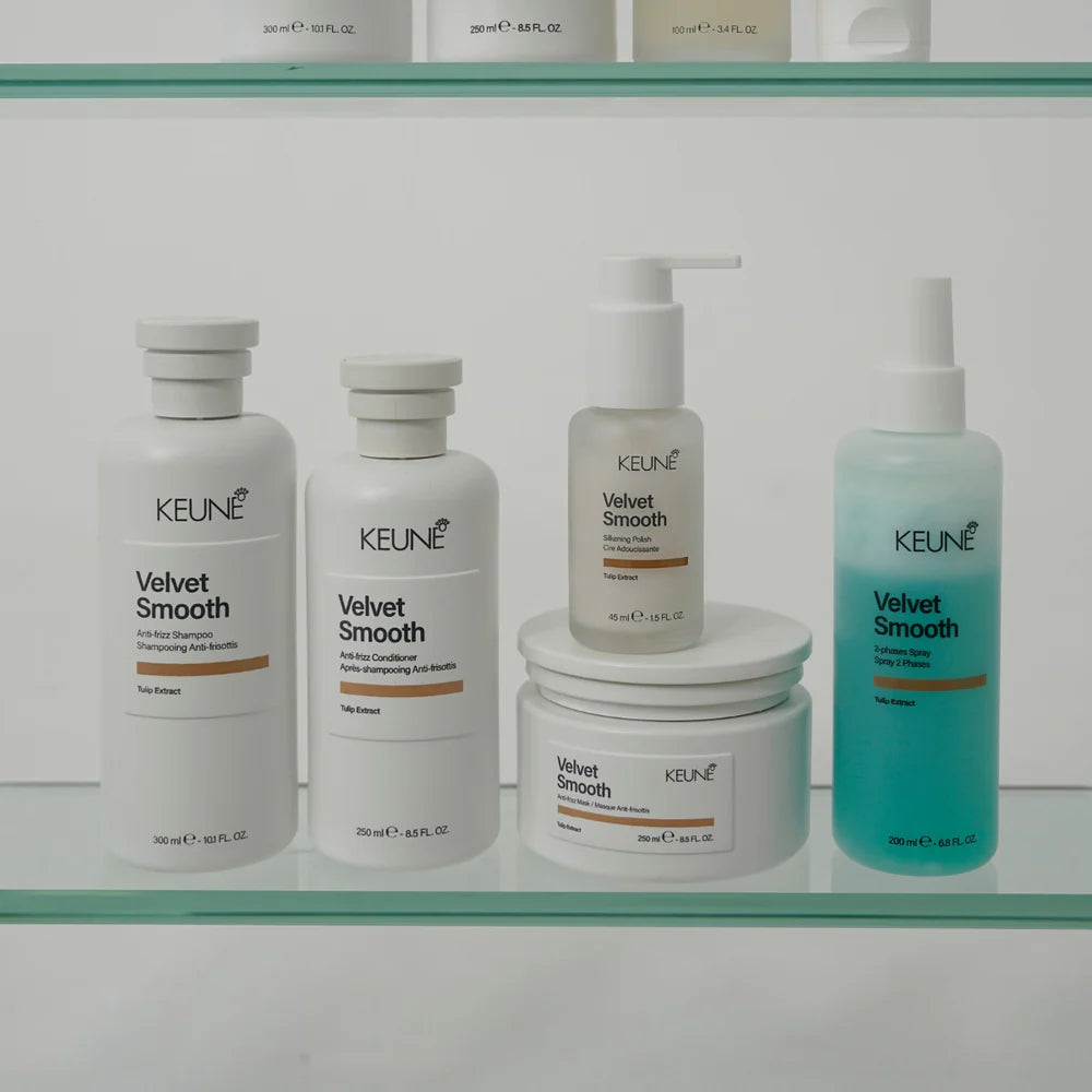 Keune hair care products on a glass shelf